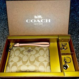 Coach hand wallet with charms